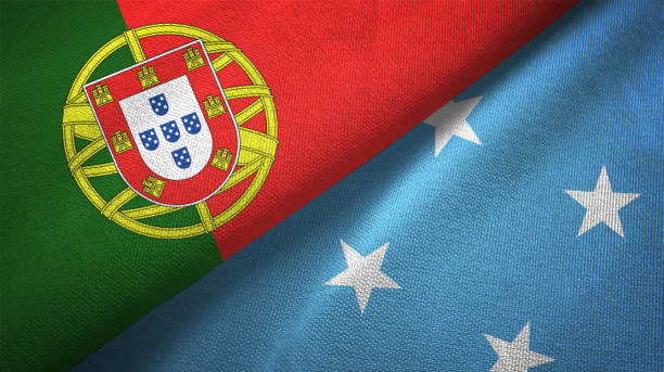 istock Micronesia and Portugal two flags together textile cloth, fabric texture 1124481494