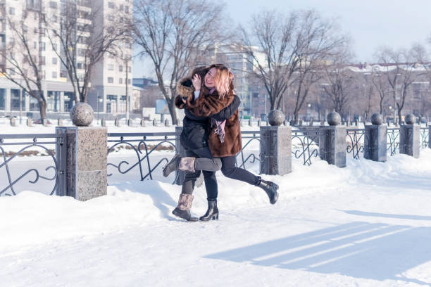 Woman in blue coat outdoors in winter.