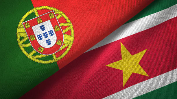 istock Suriname and Portugal two flags together textile cloth, fabric texture 1124482249