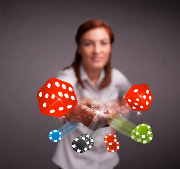 istock Young woman throwing dices and chips 1124482366