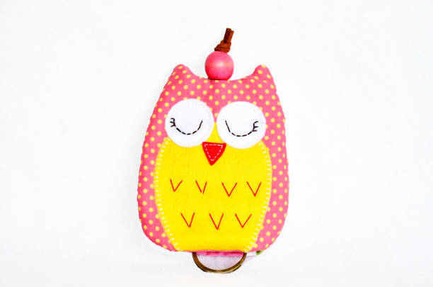 istock DIY handmade key cover owl doll pattern made from colorful fabric and leather and plastic beads in workshop thai style 1124482485