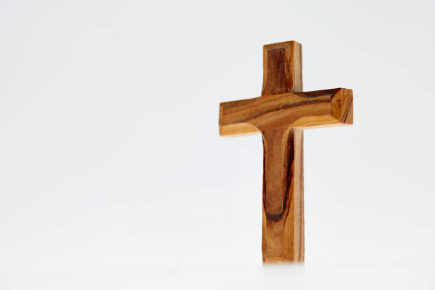 istock Wooden simple crucifix on white background 1124482512