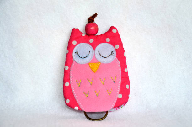 istock DIY handmade key cover owl doll pattern made from colorful fabric and leather and plastic beads in workshop thai style 1124482764