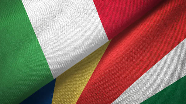 istock Seychelles and Italy two flags together textile cloth, fabric texture 1124485115