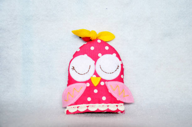 istock DIY handmade key cover owl doll pattern made from colorful fabric and leather and plastic beads in workshop thai style 1124485200