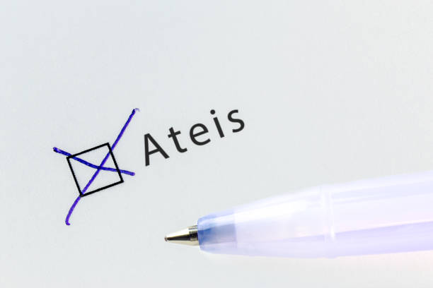istock Ateis - checkbox with a cross on white paper with blue pen. 1124485402