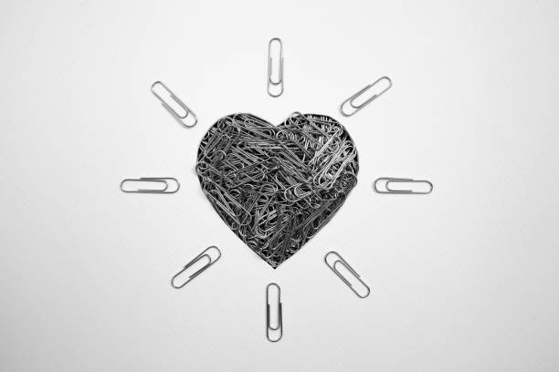 Black and white picture of a heart shape made with paperclips