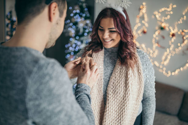 istock Young man is proposing to his girlfriend 1124486387