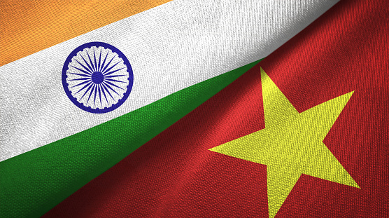 Vietnam and India flags together textile cloth, fabric texture