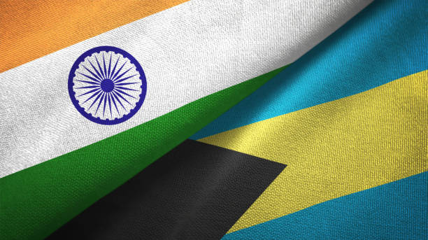 istock Bahamas and India two flags together textile cloth, fabric texture 1124486962