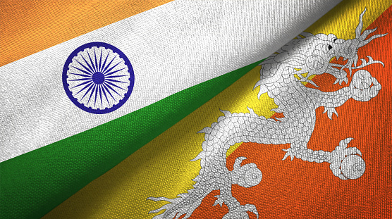 Bhutan and India flags together textile cloth, fabric texture