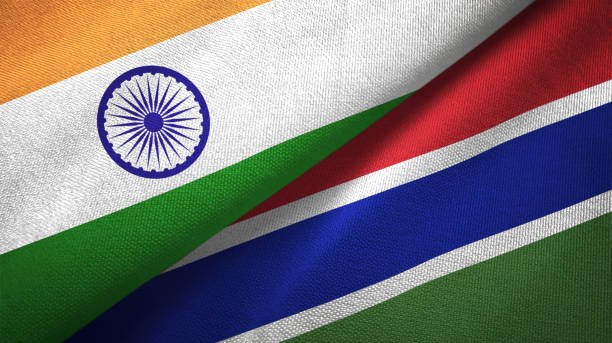 istock Gambia and India two flags together textile cloth, fabric texture 1124487640