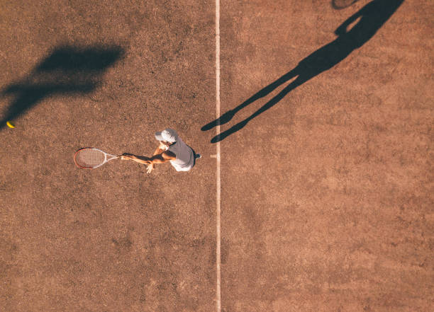 istock drone view on tennis player in action 1124487741