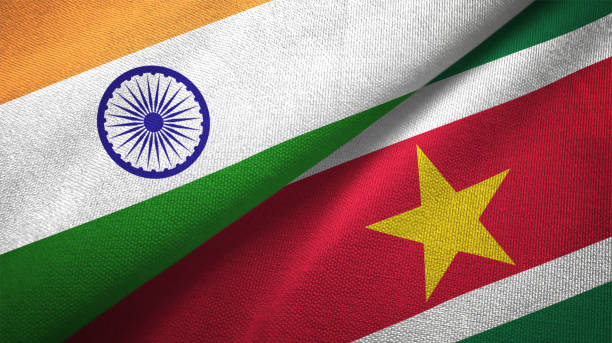 istock Suriname and India two flags together textile cloth, fabric texture 1124487954