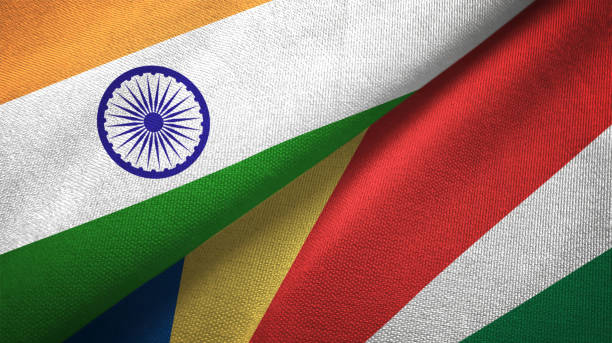 istock Seychelles and India two flags together textile cloth, fabric texture 1124488131