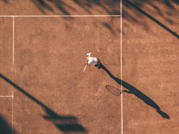 istock drone view over tennis player awaiting the service 1124488199