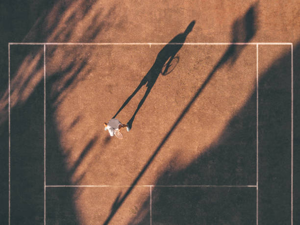 istock drone view over tennis player awaiting the service 1124488253