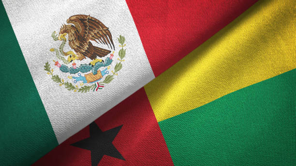 istock Guinea-Bissau and Mexico two flags together textile cloth, fabric texture 1124489120