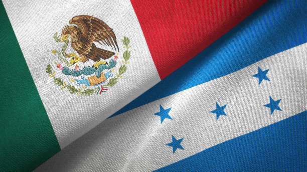 istock Honduras and Mexico two flags together textile cloth, fabric texture 1124489125