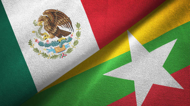 istock Myanmar and Mexico two flags together textile cloth, fabric texture 1124489204