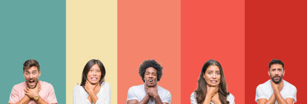 istock Collage of different ethnics young people over colorful stripes isolated background shouting and suffocate because painful strangle. Health problem. Asphyxiate and suicide concept. 1124489660