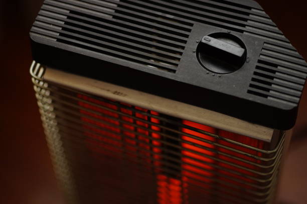 istock Vintage electric heater Ugolek with a burning lamp rod 1124492747