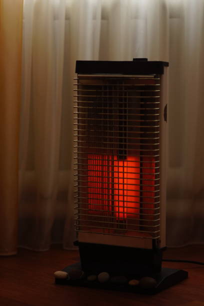 istock Vintage electric heater Ugolek with a burning lamp rod 1124492751