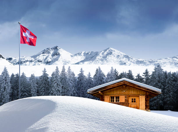Swiss flag in front of the Wildstrubel mountain in the Bernese Alps