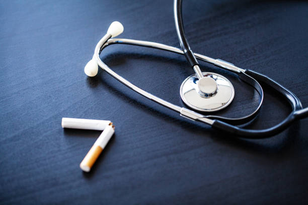 istock Stop smoking concept on background with broken cigarettes. Heap of cigarettes. No smoking 1124496922