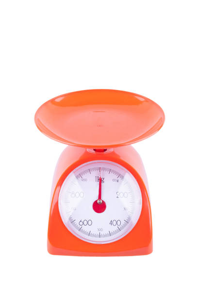 istock orange weighing scales with pan and dial on white background kitchen equipment object isolated 1124497207