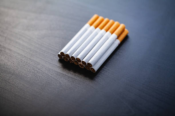 istock Stop smoking concept on background with broken cigarettes. Heap of cigarettes. No smoking 1124497230
