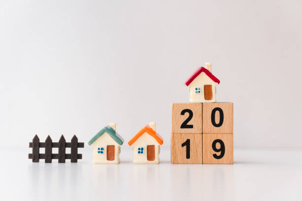 istock Miniature house with wooden block year 2019 1124501469