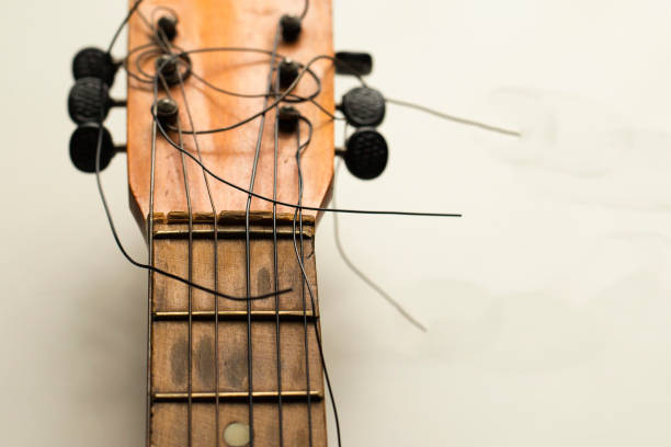 strings of an old guitar strings of an old guitar musical instrument string stock pictures, royalty-free photos & images