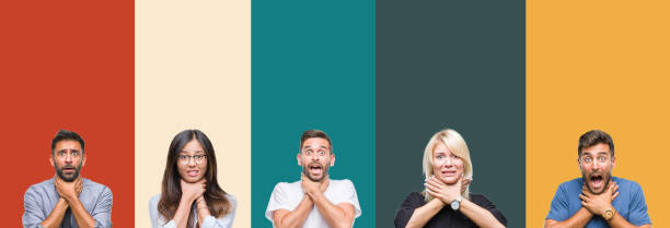 istock Collage of different ethnics young people over colorful stripes isolated background shouting and suffocate because painful strangle. Health problem. Asphyxiate and suicide concept. 1124503579