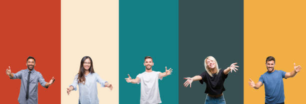 istock Collage of different ethnics young people over colorful stripes isolated background looking at the camera smiling with open arms for hug. Cheerful expression embracing happiness. 1124504085