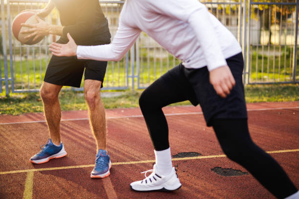 istock Two basketball players playing outdoor 1124505184