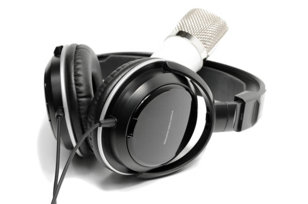 istock White microphone and black headphones, isolated on white background 1124505983