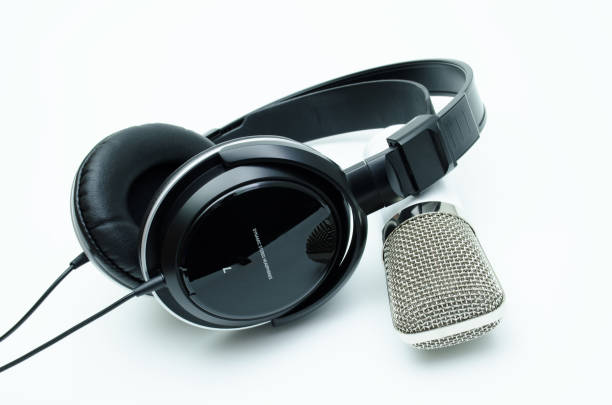 istock White microphone and black headphones, on white background 1124506013