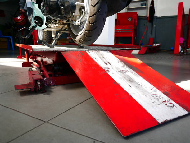 istock Jack lift with motorcycle repair service 1124507400
