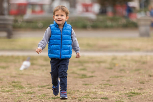 istock Happy Boy Walking In The Park 1124508312