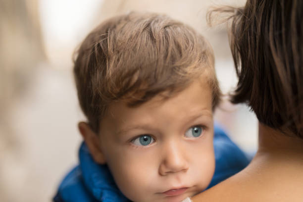 istock Mum carrying a charming young boy outdoors 1124509556