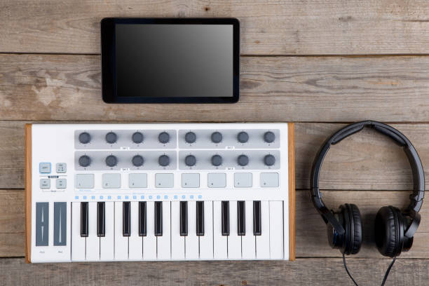 istock Close up of MIDI controller volume fader, knob and keys. 1124514353