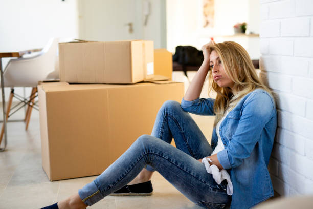 istock Tired woman exhausted while moving into new home 1124515809
