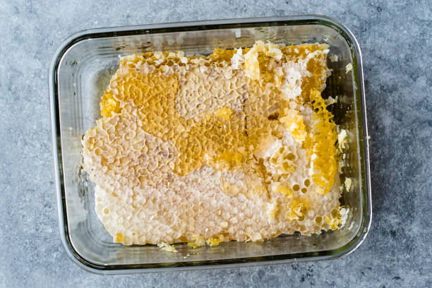 istock Fresh Honeycomb Pieces with Honey in Glass Bowl. 1124517330