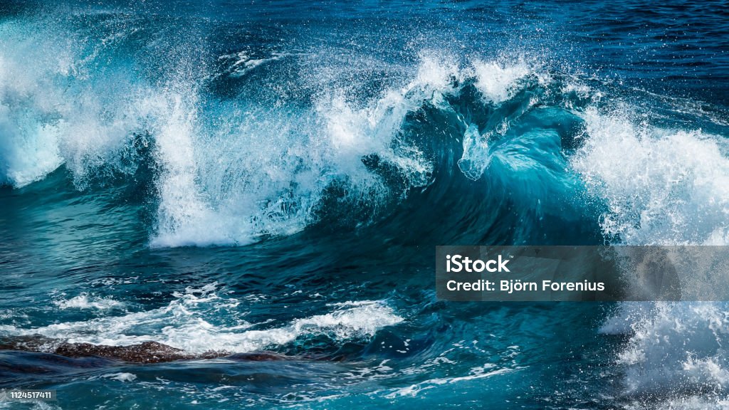 Big beautiful wave in turquoise water Big beautiful wave in turquoise water. Tall - High Stock Photo