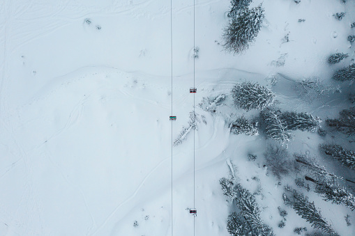 Scenic aerial view of cable car in Carpathian mountains  in winter