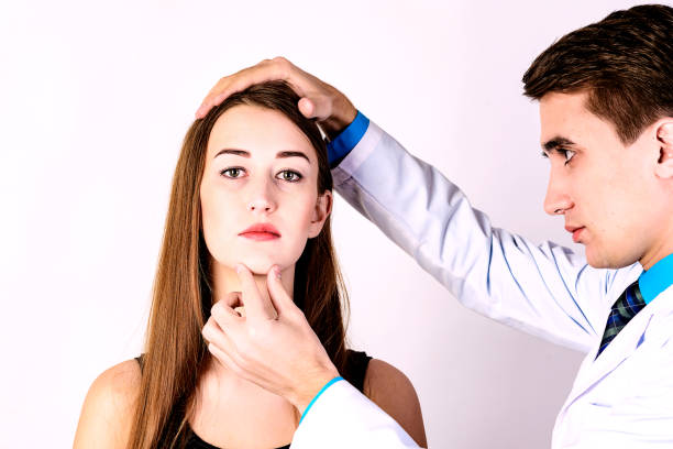 istock Face skin check before plastic surgery. Beautician touching woman face. 1124519180