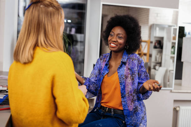 istock Beautiful dark-skinned stylist in an orange top feeling great 1124520119