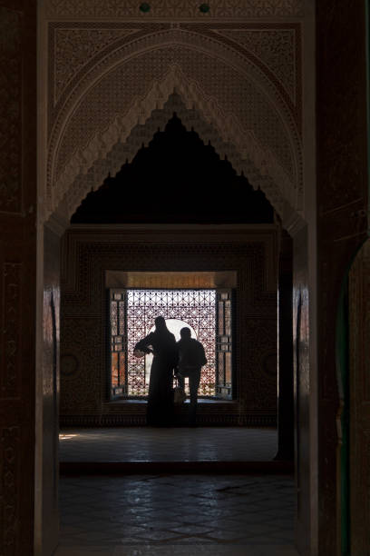 istock Couple looking through a window at Telouet Kasbah, Morocco 1124521500