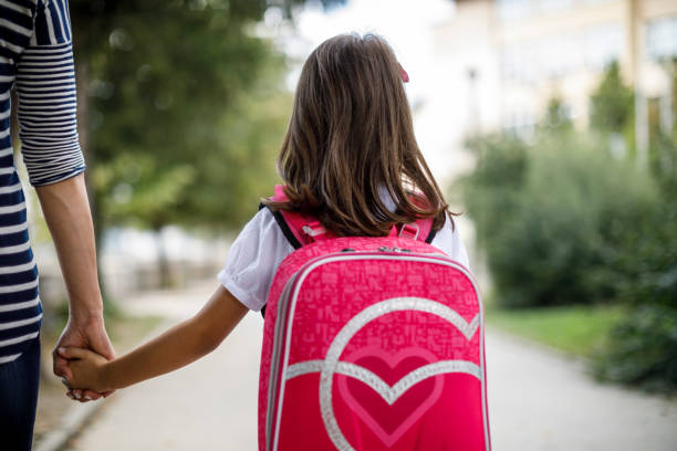 istock Mother taking her daughter to school 1124522723